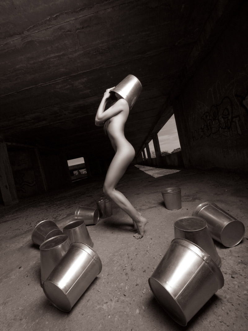 Beautiful woman body with metal buckets