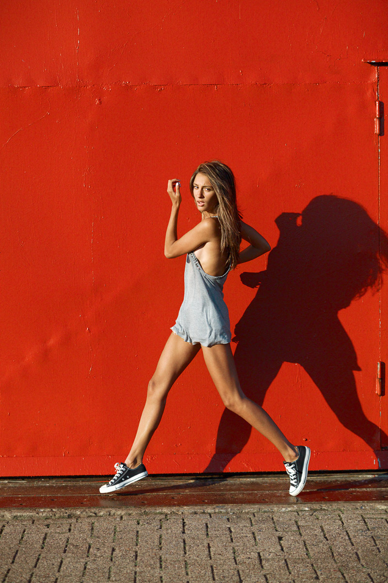 Running woman on red background